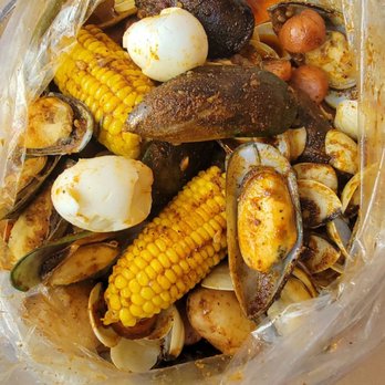 Crafty Crab - Mussels and clams with corn, sausage, eggs, and potatoes - Seafood Near Me - Tallahassee, Florida Crafty Crab - Mussels and clams with corn, sausage, eggs, and potatoes - Seafood Near Me - Tallahassee, Florida
