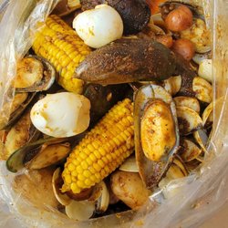 Crafty Crab - Mussels and clams with corn, sausage, eggs, and potatoes