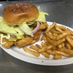 Plaza Inn Family Restaurant - Hand breaded tenderloin w/ my choice of toppings on a brioche bun and French fries
