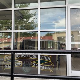 the reflection of a bicycle in the window