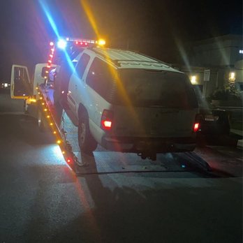 Edwins Towing Service - My truck on their tow truck before the abandoned me and my truck in the middle of the street to go get someone else's car. Unbelievable. - Towing Near Me - Upland, California