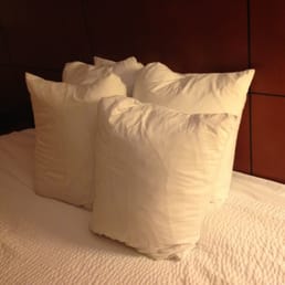 The tiniest hotel pillows ever.