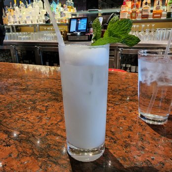 P.F. Chang's - a glass of water with a straw and a mint leaf garnish - Chinese Near Me - Aurora, Colorado P.F. Chang's - a glass of water with a straw and a mint leaf garnish - Chinese Near Me - Aurora, Colorado