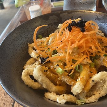 Travesias - Calamari topped with shredded carrots and Caviar - Latin American Near Me - Bronx, New York Travesias - Calamari topped with shredded carrots and Caviar - Latin American Near Me - Bronx, New York