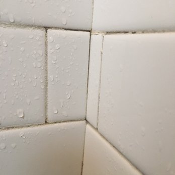 NW Tile Project - Zero grout and showing signs or water intrusion. - Tiling Near Me
