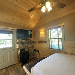 View of front door from our bed! High vaulted ceiling with functional fan