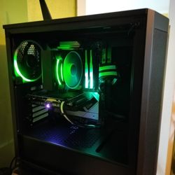 Same Day Computer Repair - A black PC with clear window showing green RGB lighting and fans