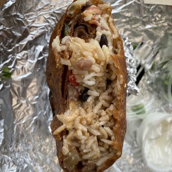 Cabo Bob's Burritos - Too much rice and it was like this throughout. - Mexican Near Me - Houston, Texas