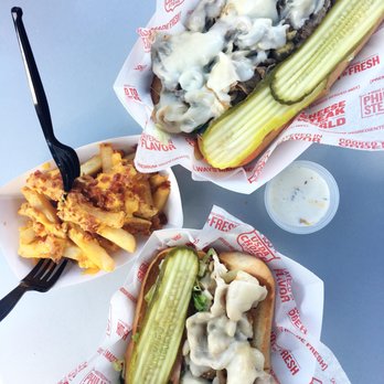 Charleys Cheesesteaks - Jalapeno Philly (top), Chicken Philly (bottom), and bacon cheese fries. - New American Near Me - Orlando, Florida Charleys Cheesesteaks - Jalapeno Philly (top), Chicken Philly (bottom), and bacon cheese fries. - New American Near Me - Orlando, Florida