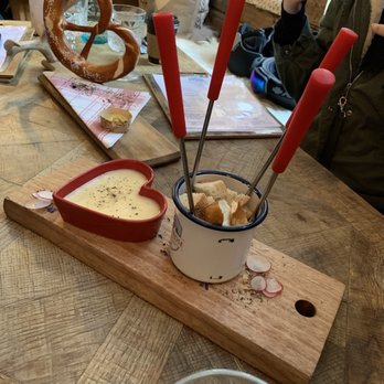 Alpenrose Vail - Cheese fondue appetizer with bread and pretzel too filling as a starter - German Near Me - Vail, Colorado Alpenrose Vail - Cheese fondue appetizer with bread and pretzel too filling as a starter - German Near Me - Vail, Colorado