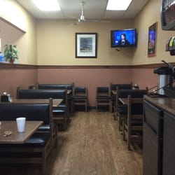 Piggly Wiggly - They have a dining room with TV where you can eat at after ordering from the deli