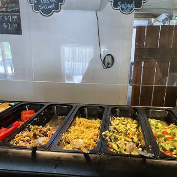 Sunken Gardens - a buffet with a variety of food items - American Near Me - Shiner, Texas