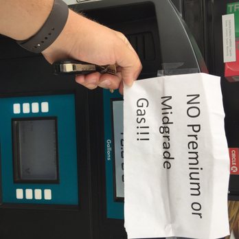 Corner Store - a hand holding a cell phone in front of a gas pump - Gas Stations Near Me - Dripping Springs, Texas Corner Store - a hand holding a cell phone in front of a gas pump - Gas Stations Near Me - Dripping Springs, Texas
