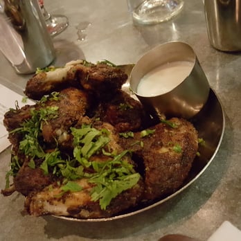 Pondicheri - This is there chicken wing appetizers. Make sure to order the garlic naan.one should be enough for two people. - Indian Near Me - Houston, Texas Pondicheri - This is there chicken wing appetizers. Make sure to order the garlic naan.one should be enough for two people. - Indian Near Me - Houston, Texas