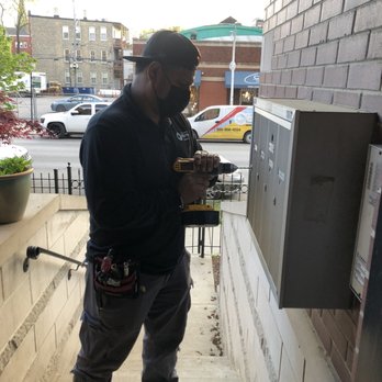 Chicago Locksmiths - Technician working on mailbox the same day as called - Security Systems Near Me - Chicago, Illinois