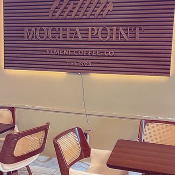 Mocha Point Coffee - Seating area by sign - Coffee & Tea Near Me - Overland Park, Kansas Mocha Point Coffee - Seating area by sign - Coffee & Tea Near Me - Overland Park, Kansas