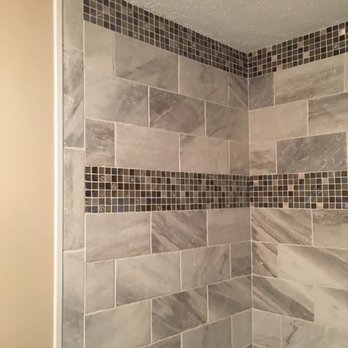 JLC Construction - a shower with a tiled wall - General Contractors Near Me JLC Construction - a shower with a tiled wall - General Contractors Near Me