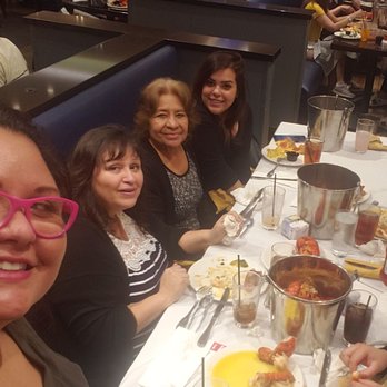 Serrano Buffet - Family enjoying endless lobster tails. - Buffets Near Me - Highland, California Serrano Buffet - Family enjoying endless lobster tails. - Buffets Near Me - Highland, California