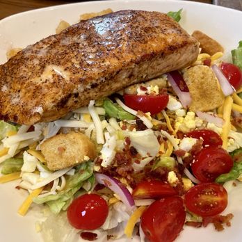 Outback Steakhouse - House salad, topped with the perfectly cooked Salmon. - Steakhouses Near Me - Beaumont, Texas Outback Steakhouse - House salad, topped with the perfectly cooked Salmon. - Steakhouses Near Me - Beaumont, Texas