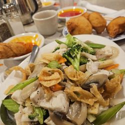 China Wok - This is chicken Chow Mein. Garlic chicken and sauces. Egg rolls, Pork Dumplings. "Amazingly Good "