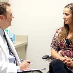 Michael Tracy, MD - Dr. Tracy consults with a patient before LASIK.