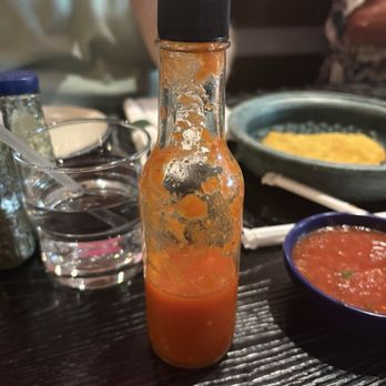 The Guadalupe on Main - Hot Sauce with no label for us to identity it or its ingredients - Bars Near Me - Mesa, Arizona