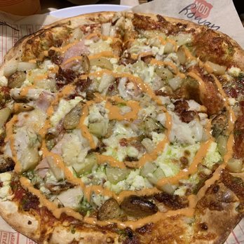 MOD Pizza - I call this one the cordon blue. Pesto, red sauce, ham, chicken, bacon, pineapple, all cheeses, roasted garlic and finished with Sri-rancha. - Fast Food Near Me - Vancouver, Washington