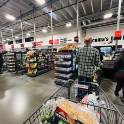 WinCo Foods - Open self check out and lines in the only two open checker lanes.