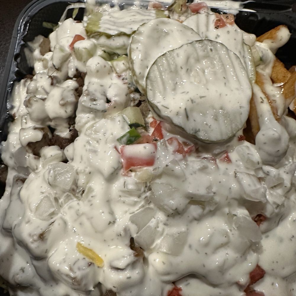 Halal Grill Eats - My chicken and lamb over rice. I drowned it in sauce and toppings. Yes, I'm extra. - Fast Food Near Me - Queens, New York Halal Grill Eats - My chicken and lamb over rice. I drowned it in sauce and toppings. Yes, I'm extra. - Fast Food Near Me - Queens, New York