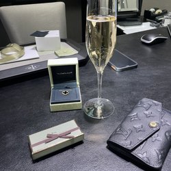 Van Cleef & Arpels - Onyx pendant along with some chocolate and champagne