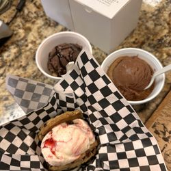 The DW Cookie - Raspberry Cheesecake ice cream with two cranberry cookies. Warmed up Chocolate chip cookies with chocolate ice cream on top