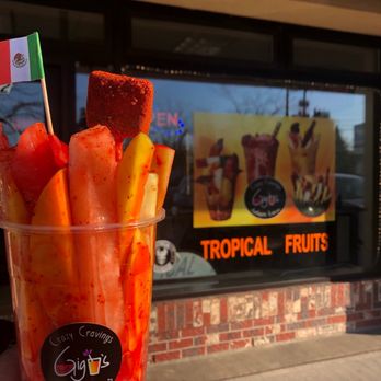Gigi's Crazy Cravings - a hand holding a cup of fruit - Acai Bowls Near Me - Bellingham, Washington