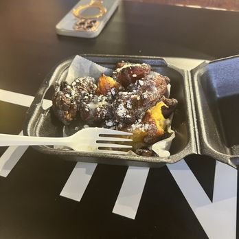 Caribbean Tingz - fried plantains with sweetened condensed mile and powdered sugar - Caribbean Near Me - Houston, Texas Caribbean Tingz - fried plantains with sweetened condensed mile and powdered sugar - Caribbean Near Me - Houston, Texas