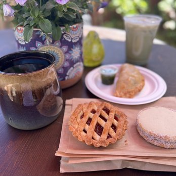Cafe Guarani - Pour over coffee, guava tart, pulled pork empanada, and Alfaro cookie plus Iced Matcha with oat milk. - Cafes Near Me - Pacific Grove, California