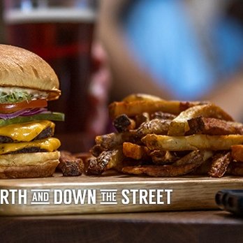 Original Joe's - a hamburger and fries on a cutting board - Bars Near Me - Fort St John, British Columbia Original Joe's - a hamburger and fries on a cutting board - Bars Near Me - Fort St John, British Columbia