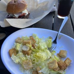 Rectum Cesar salad and burger.