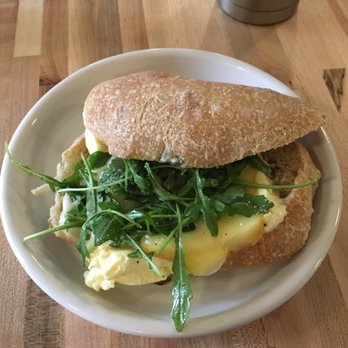 Gracious Bakery + Cafe - The Oliver~Egg, smoked cheddar & aioli on green onion bread. - Breakfast & Brunch Near Me - New Orleans, Louisiana