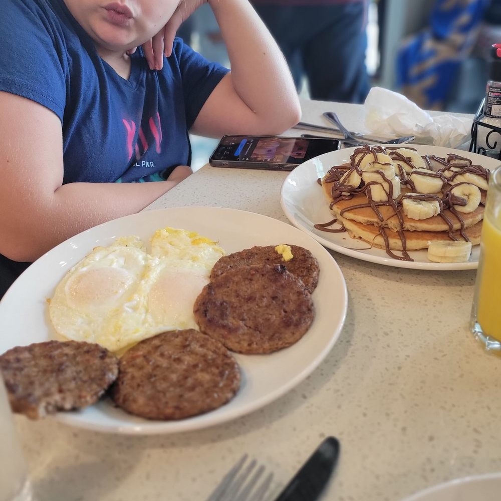 Scrambler Cafe Princeton - Nutella banana pancakes, sausage and over easy eggs - Breakfast & Brunch Near Me - Princeton, Texas Scrambler Cafe Princeton - Nutella banana pancakes, sausage and over easy eggs - Breakfast & Brunch Near Me - Princeton, Texas