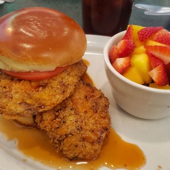 Metro Diner - Spicy Honey Chicken Sandwich (Buttermilk-marinated chicken in signature spicy honey sauce & tomato), side of Fresh Seasonal Fruit. - Diners Near Me - Indianapolis, Indiana Metro Diner - Spicy Honey Chicken Sandwich (Buttermilk-marinated chicken in signature spicy honey sauce & tomato), side of Fresh Seasonal Fruit. - Diners Near Me - Indianapolis, Indiana