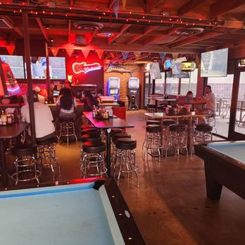 Pinky's - Seating area with two dart boards in back - Sports Bars Near Me - Phoenix, Arizona Pinky's - Seating area with two dart boards in back - Sports Bars Near Me - Phoenix, Arizona