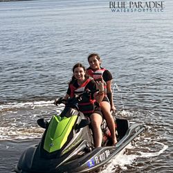 Blue Paradise Watersports - Happy customers riding jet skis!