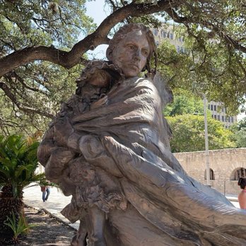 The Alamo - Beautiful bronze statue of a woman escaping with her child - Museums Near Me - San Antonio, Texas