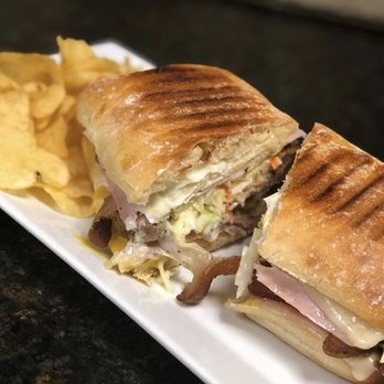 Little Bit Eatery - Our Cuban is made with delicious Marinated Roasted Pork, Ham, Swiss Cheese, Pickles & Creamy Coleslaw - Italian Near Me - Brookfield, Connecticut Little Bit Eatery - Our Cuban is made with delicious Marinated Roasted Pork, Ham, Swiss Cheese, Pickles & Creamy Coleslaw - Italian Near Me - Brookfield, Connecticut