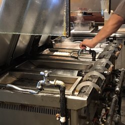 Photo of 原宿餃子樓 - Shibuya, 13, JP. 4 compartments to steam and pan fry each order of gyozas to get them consistently juicy on the inside and crispy on the outside.