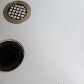 Main St. Plumbing - Fiberglass shower pan crack to right of drain pipe. About 2 inches long. - Plumbing Near Me Main St. Plumbing - Fiberglass shower pan crack to right of drain pipe. About 2 inches long. - Plumbing Near Me