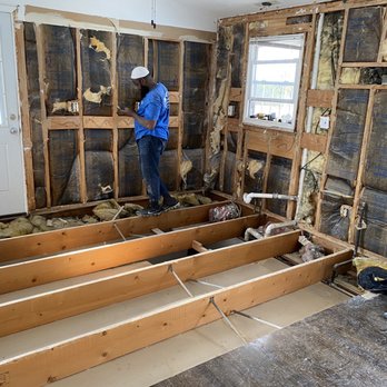 JJK Contracting - a man standing in a room that is being remodeled - General Contractors Near Me - East Bronx, New York