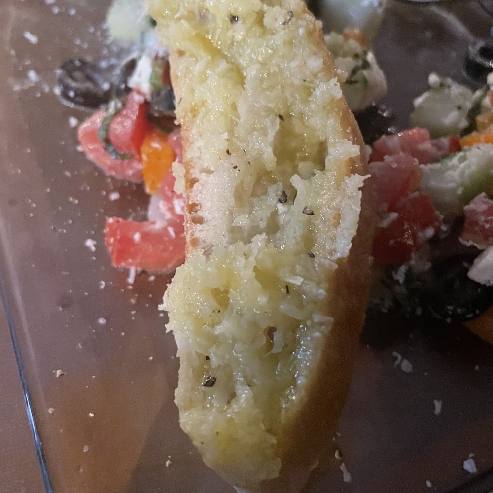 Cafe Della Via - Bread with olive oil, fresh ground pepper and fresh Parmesan cheese - Italian Near Me - Cayucos, California Cafe Della Via - Bread with olive oil, fresh ground pepper and fresh Parmesan cheese - Italian Near Me - Cayucos, California