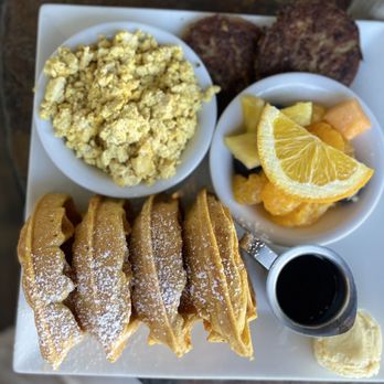 Wild Rabbit Bistro - Brunch Bazzar ($16) Vegan Pumpkin Belgian Waffle · Scrambled Tofu · Meatless Sausage · Fresh Fruit - Coffee & Tea Near Me - Ormond Beach, Florida