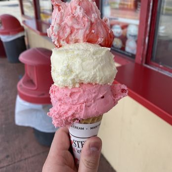 Bruster's Real Ice Cream - a hand holding an ice cream cone - Ice Cream & Frozen Yogurt Near Me - Smyrna, Georgia Bruster's Real Ice Cream - a hand holding an ice cream cone - Ice Cream & Frozen Yogurt Near Me - Smyrna, Georgia