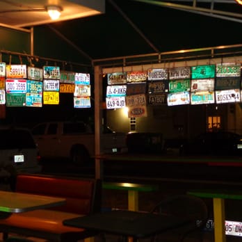 Mustard's Last Stand - Outside dining area (at night). - Hot Dogs Near Me - Melbourne, Florida Mustard's Last Stand - Outside dining area (at night). - Hot Dogs Near Me - Melbourne, Florida